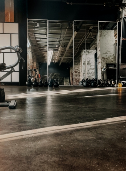 Private studio training wall with mats and equipment.