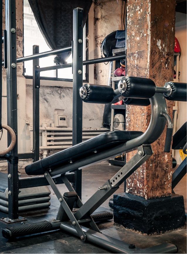 Private studio training wall with mats and equipment.